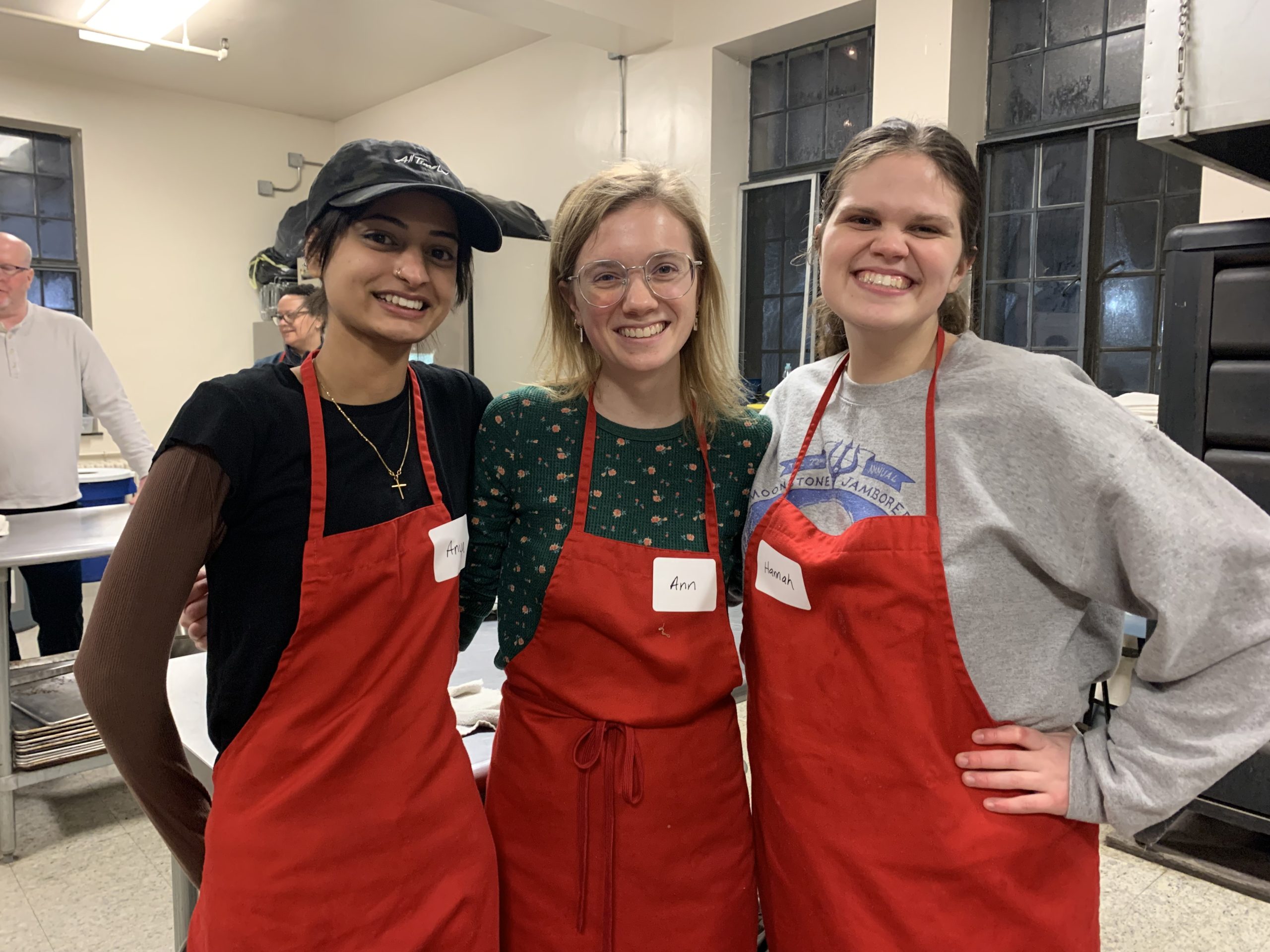 Three young adults smiling